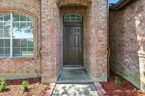 a front view of a house with a glass door