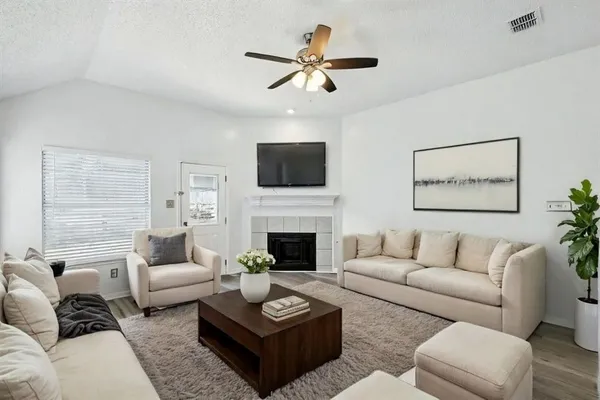 a living room with furniture a fireplace