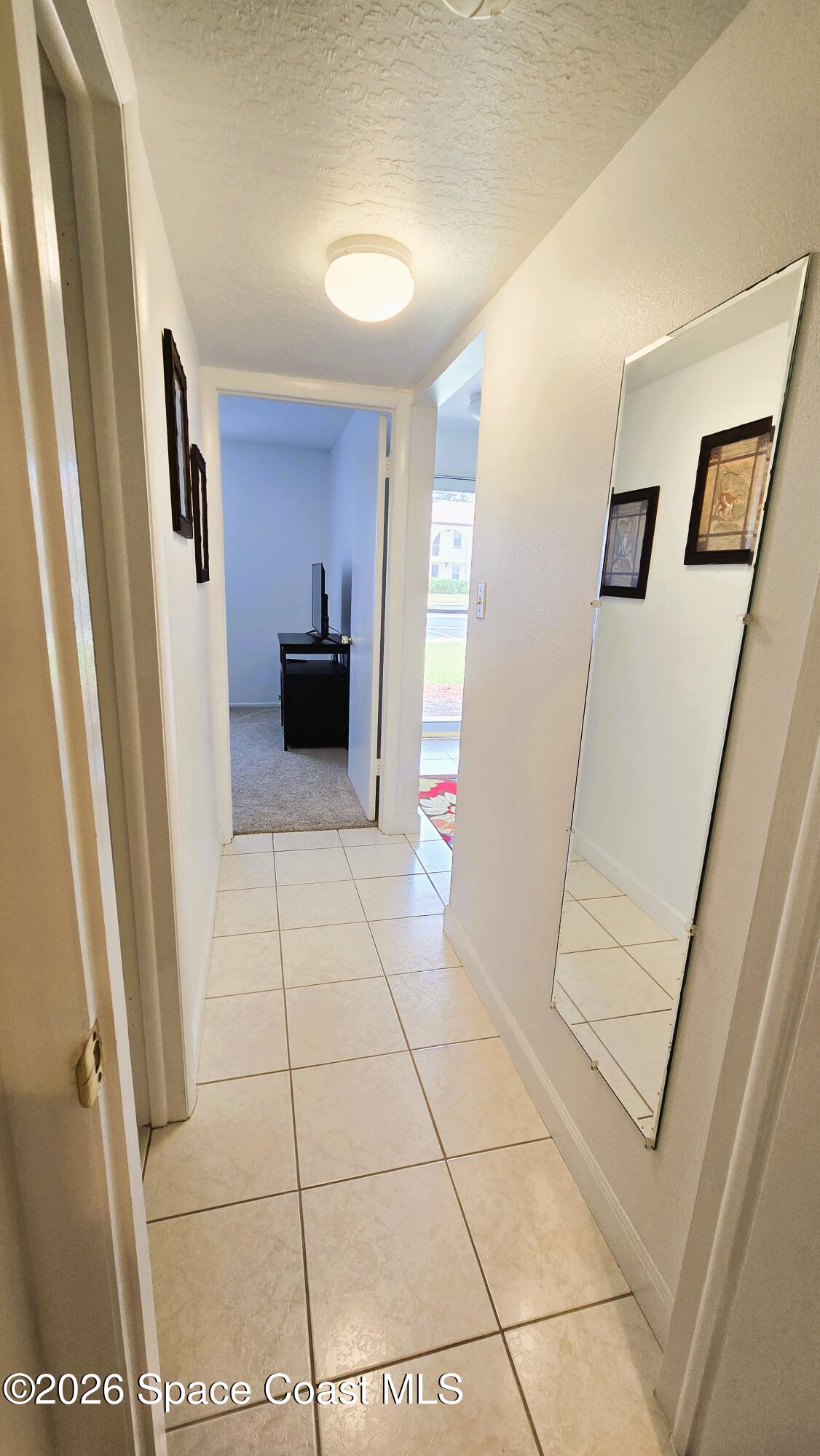 412 School Road, Unit 88 Indian Harbour Beach, FL 32937 - Photo 35 of 50 Hallway to Primary bedroom