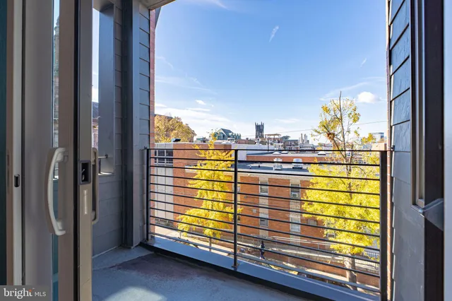 a view of a balcony door and an outdoor space