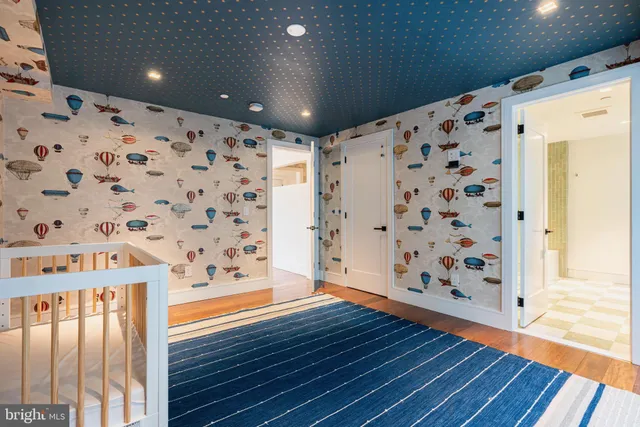 a view of wooden floor with staircase in front of it