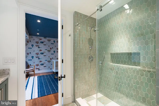 a bathroom with a shower toilet and a sink