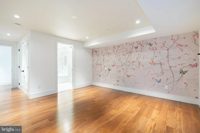 an empty room with wooden floor