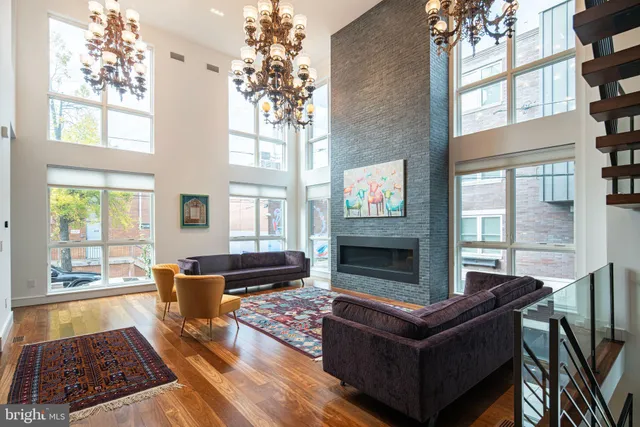 a living room with furniture fireplace and flat screen tv