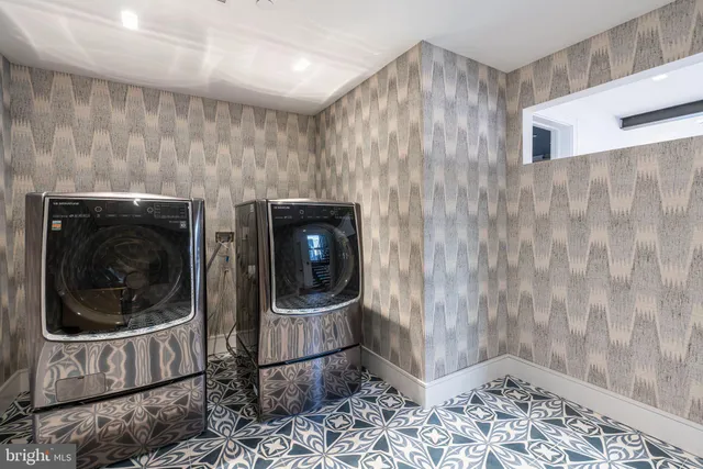 a close view of a utility room with dryer and washer