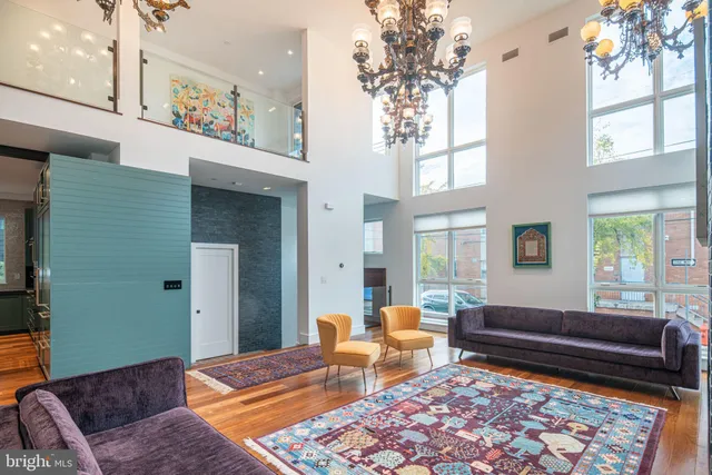 a living room with furniture and a rug