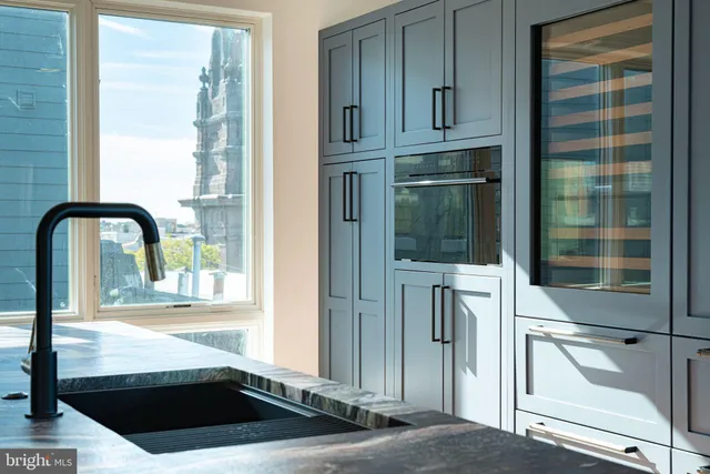 a view of a city from the kitchen from a balcony