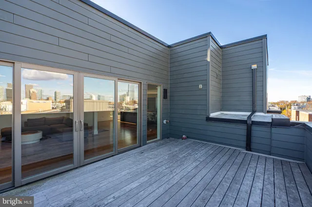 a bathroom with a granite countertop toilet sink and mirror