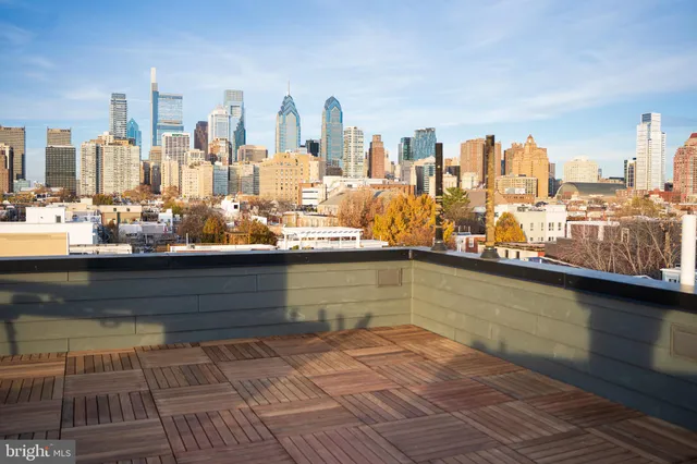 an empty room with painting on the wall and a picture of a room