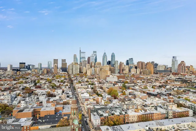 a view of hallway with furniture and a window