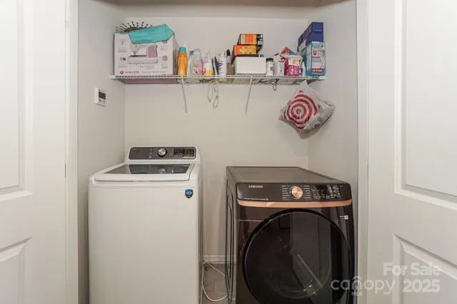 a utility room with dryer and washer