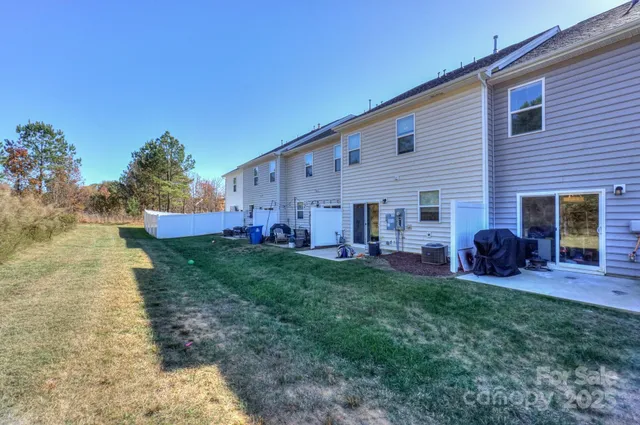 a view of a house with a backyard porch and sitting area