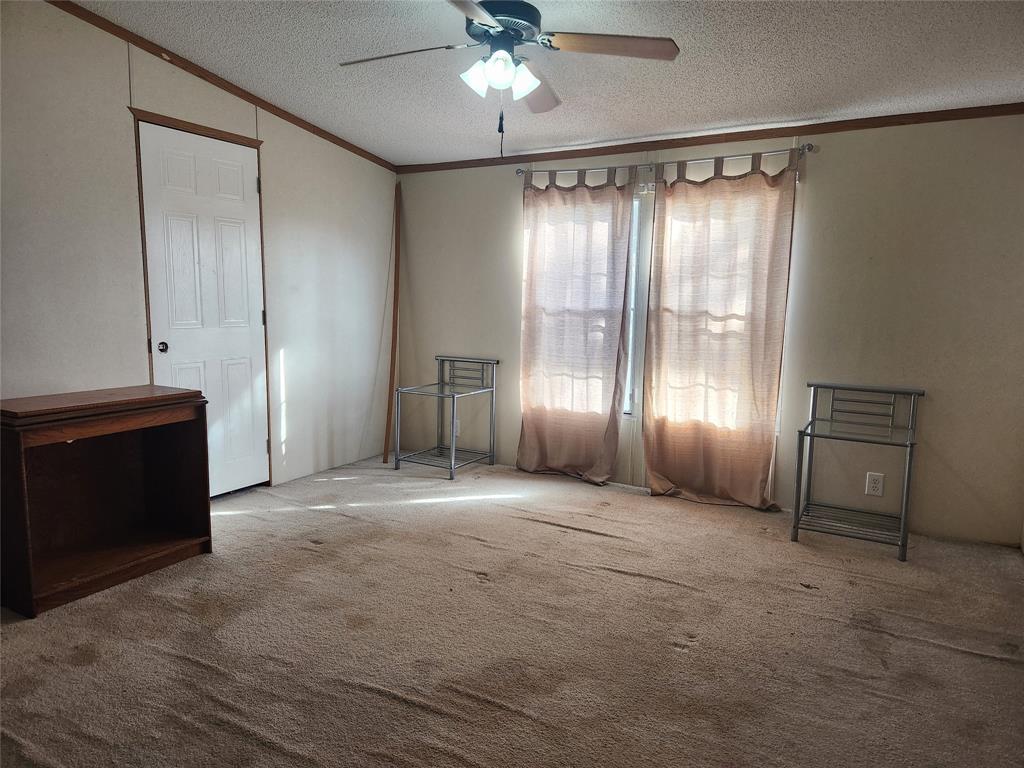 11308 County Road 313 East Tyler, TX 75708 - Photo 10 of 14 a view of empty room with a ceiling fan and window