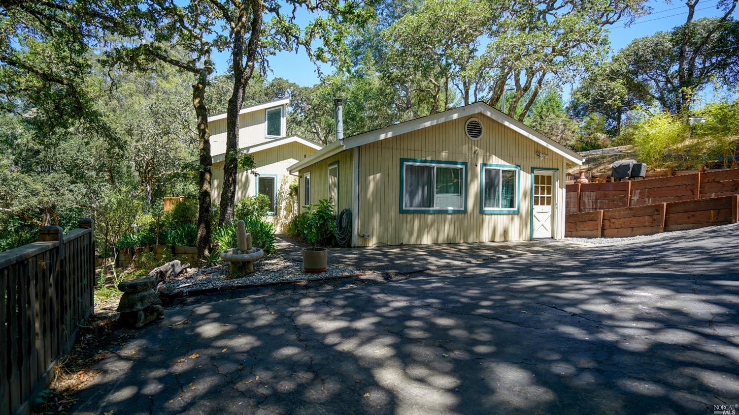 1100 Sexton Road Sebastopol, CA 95472 - Photo 1 of 1 a front view of a house with a yard and trees