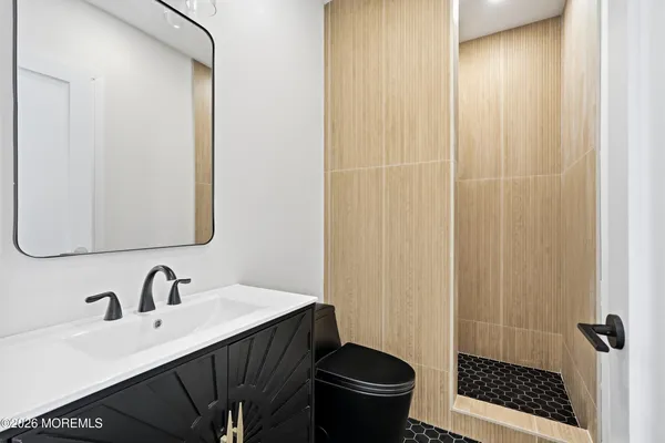 a bathroom with a bathtub and a shower