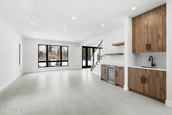 a view of a kitchen with furniture and staircase