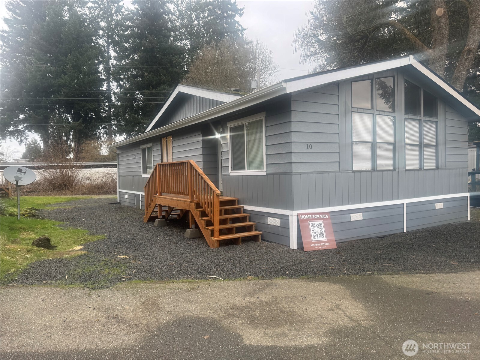 a side view of a house with a yard