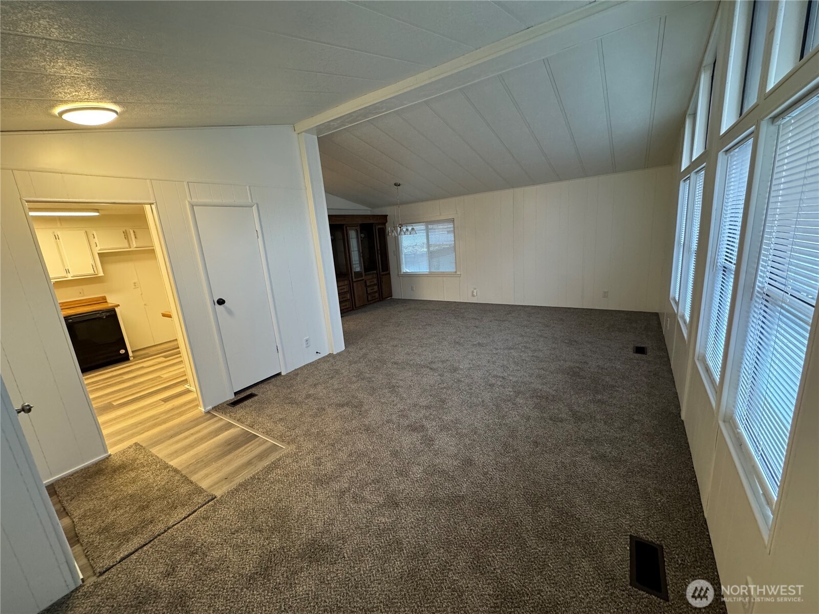 5705 Littlerock Road Southwest, Unit 10 Tumwater, WA 98512 - Photo 2 of 7 a view of a livingroom with an empty space and a window