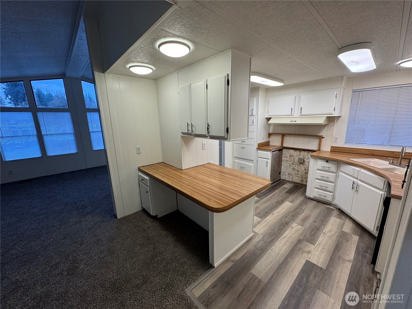 5705 Littlerock Road Southwest, Unit 10 Tumwater, WA 98512 - Photo 3 of 7 a kitchen with a stove and a refrigerator