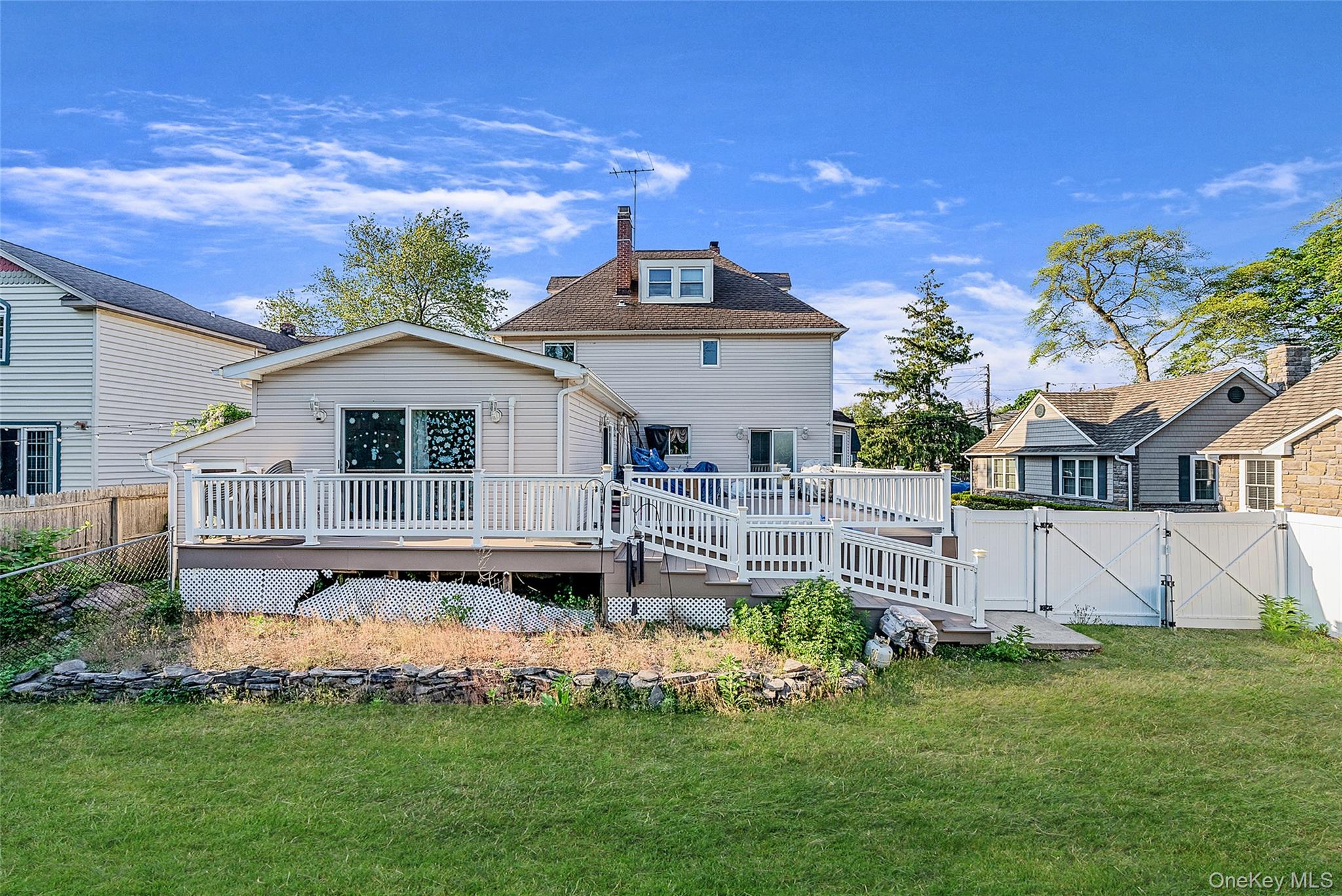 80 George Street Babylon, NY 11702 - Photo 9 of 41 a front view of house with yard and outdoor seating
