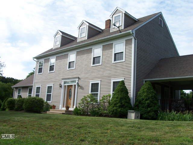 3 Concord Ridge Road Newtown, CT 06470 - Photo 1 of 1 a front view of a house with a yard