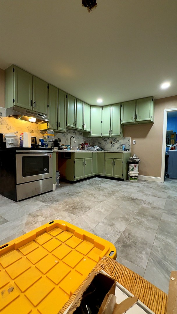 12527 Greenbriar Road Carterville, IL 62918 - Photo 7 of 12 a kitchen with kitchen island granite countertop a stove and a sink