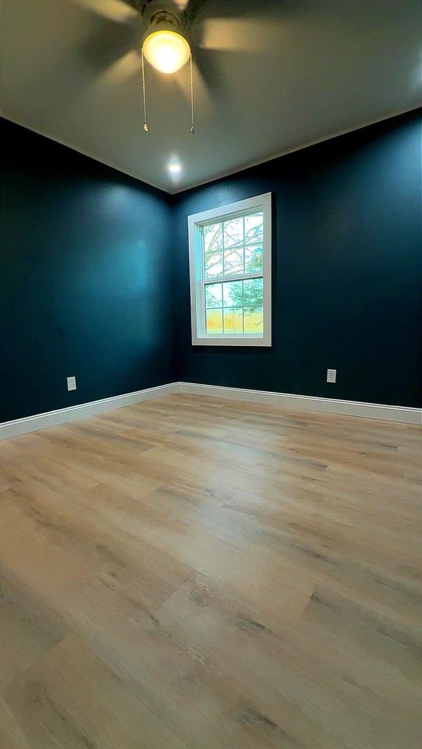 12527 Greenbriar Road Carterville, IL 62918 - Photo 10 of 12 a view of an empty room with a window