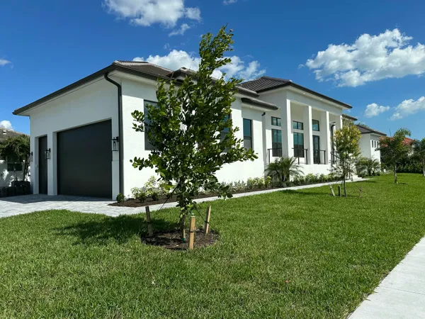 a front view of a house with a yard