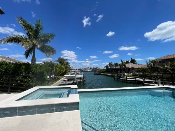 a view of a swimming pool with a yard