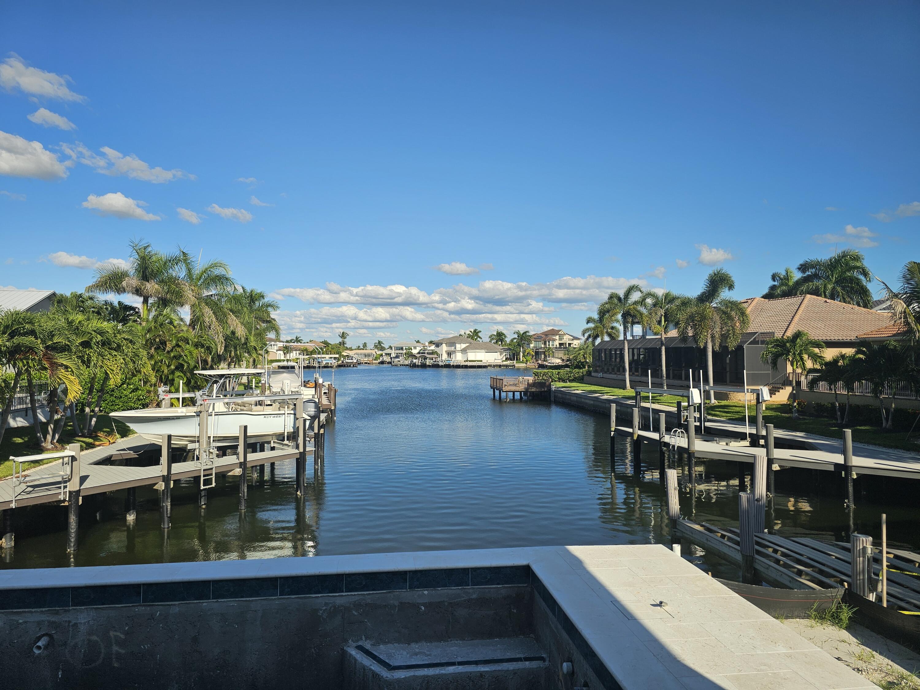 211 Landmark Street Marco Island, FL 34145 - Photo 4 of 7 a view of a lake from a balcony