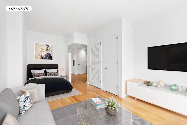 a kitchen with a table chairs and a refrigerator