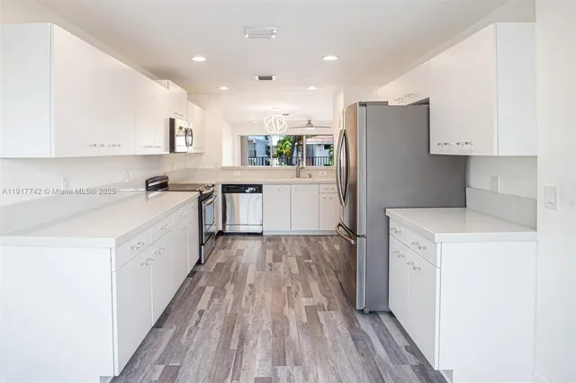 a view of hallway with washer and dryer