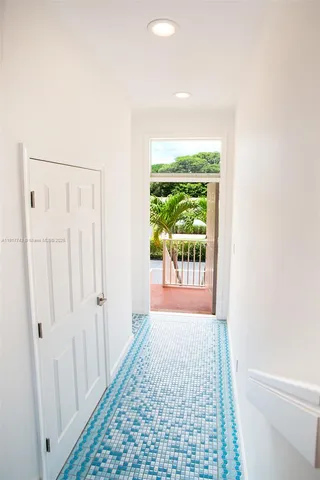 a view of an empty room and wooden floor