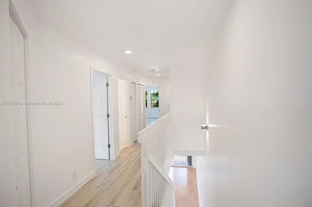 a bathroom with a sink a toilet and a window