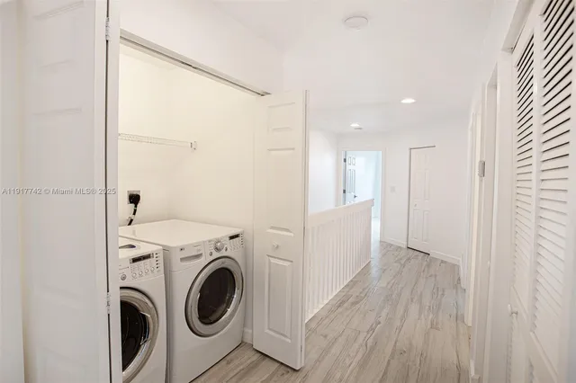 a bathroom with a toilet a sink and bathtub