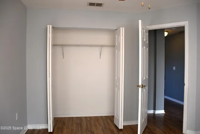 a view of front door with wooden floor