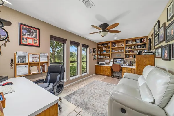 a view of a livingroom with workspace and a couch