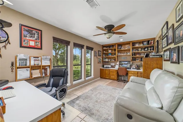 a view of a livingroom with workspace and a couch
