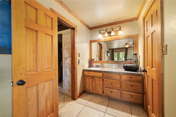 a large kitchen with a large counter top appliances and cabinets