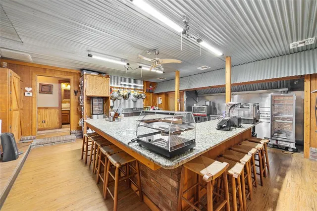 a large kitchen with a table and chairs