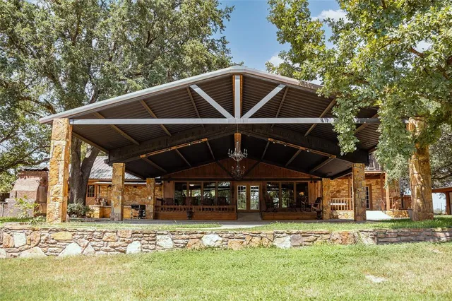 a view of a backyard with a patio