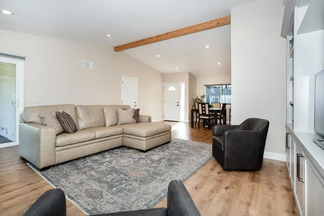 a living room with furniture and a couch