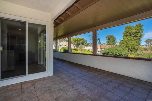 a view of a floor to ceiling window and a yard