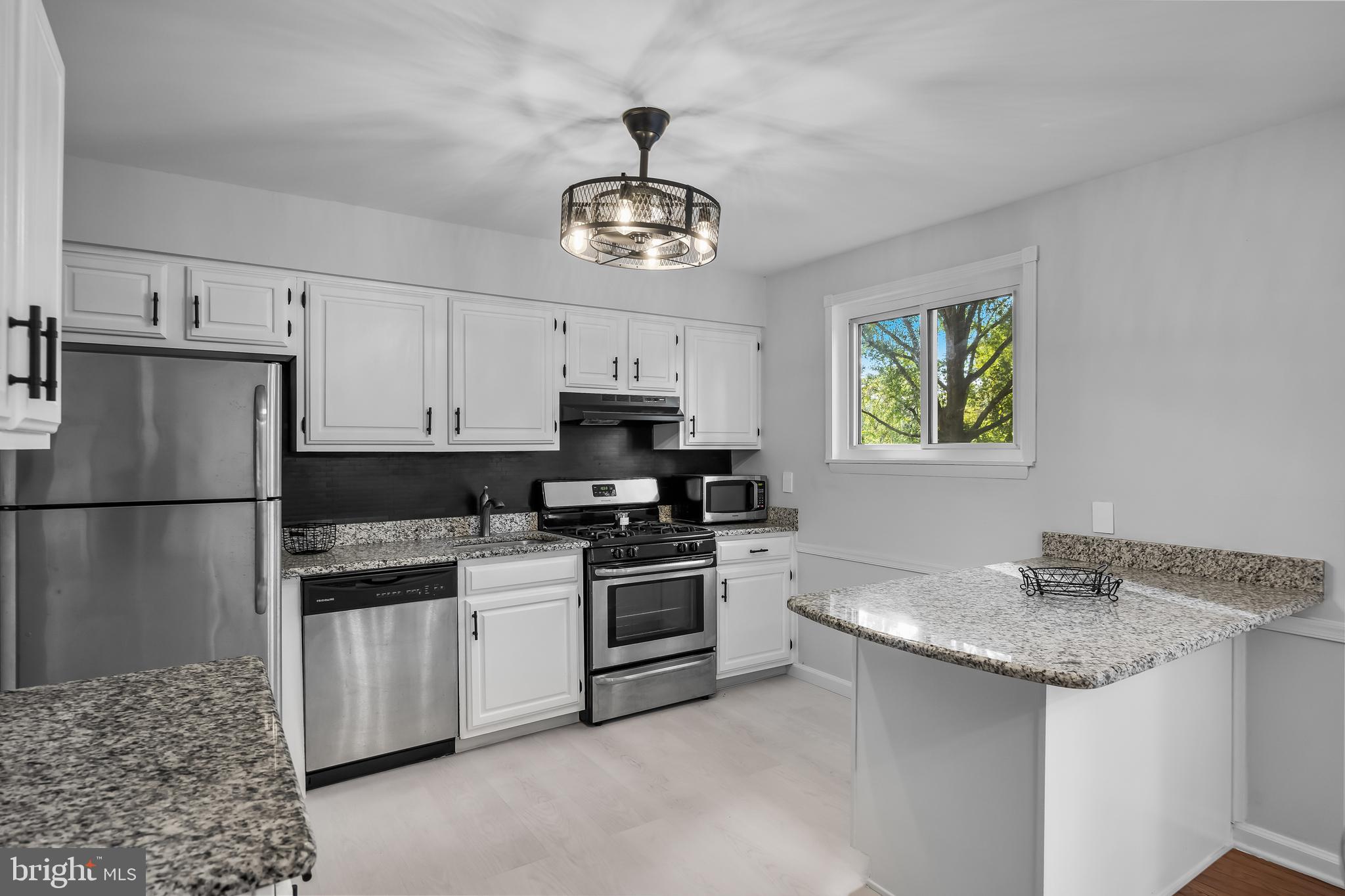 145 Tuckerton Road Shamong, NJ 08088 - Photo 3 of 19 a kitchen with stainless steel appliances granite countertop a sink stove and refrigerator