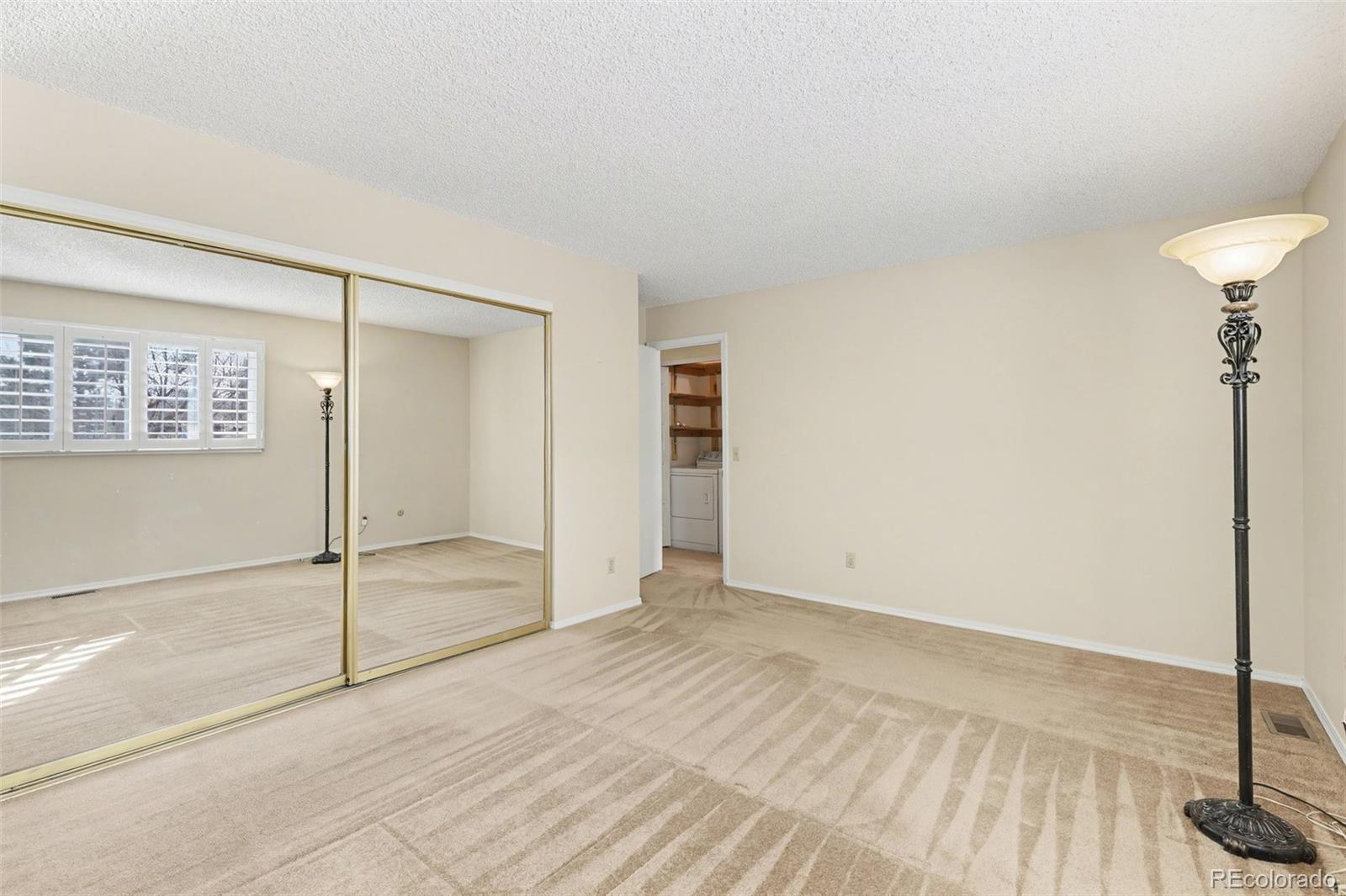 15922 East Rice Place, Unit B Aurora, CO 80015 - Photo 13 of 30 a view of an empty room with a window