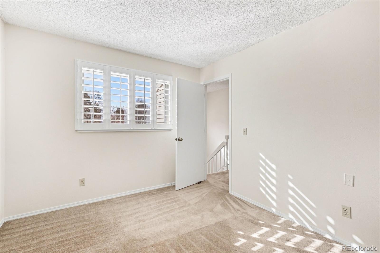 15922 East Rice Place, Unit B Aurora, CO 80015 - Photo 15 of 30 a view of a room with a window