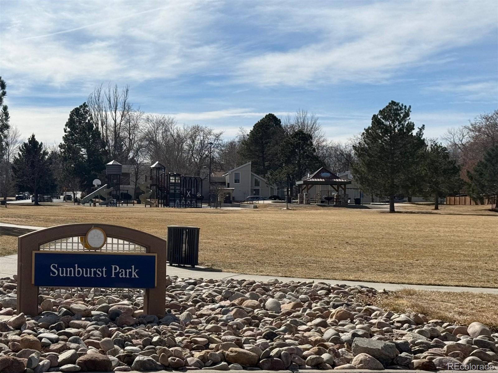 15922 East Rice Place, Unit B Aurora, CO 80015 - Photo 26 of 30 a view of a street with a building in the background