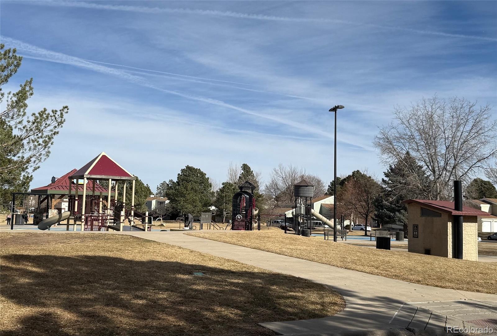 15922 East Rice Place, Unit B Aurora, CO 80015 - Photo 27 of 30 a front view of a building with trees