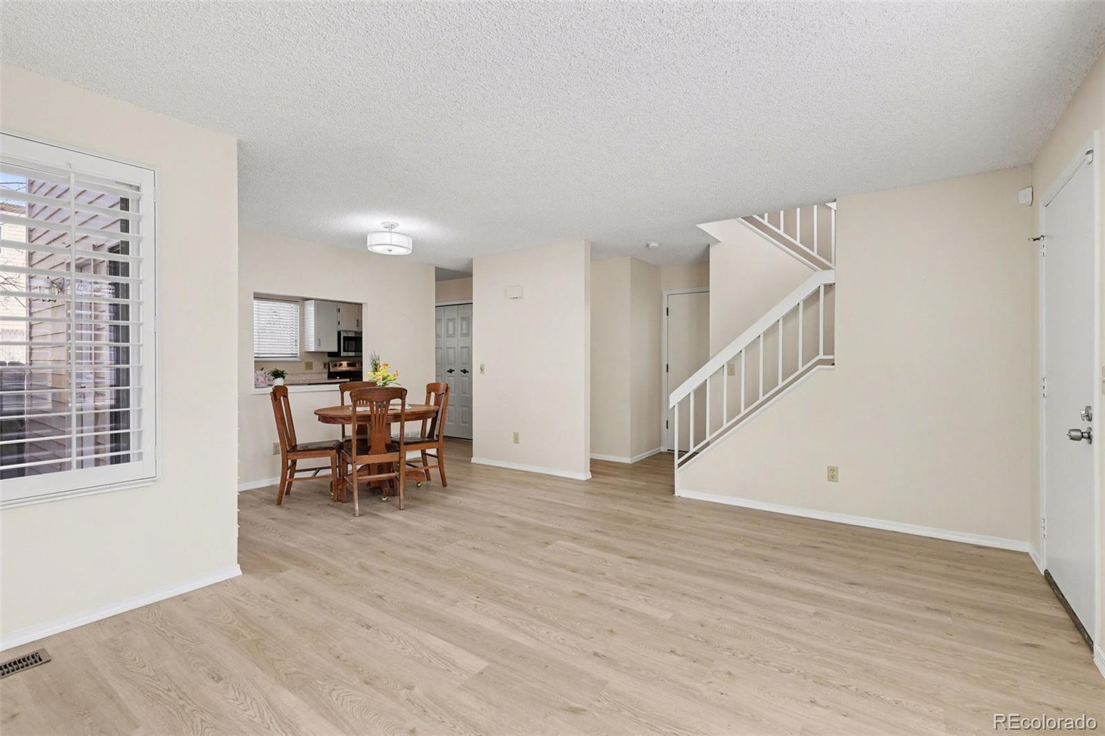 15922 East Rice Place, Unit B Aurora, CO 80015 - Photo 4 of 30 a view of a livingroom with furniture and furniture