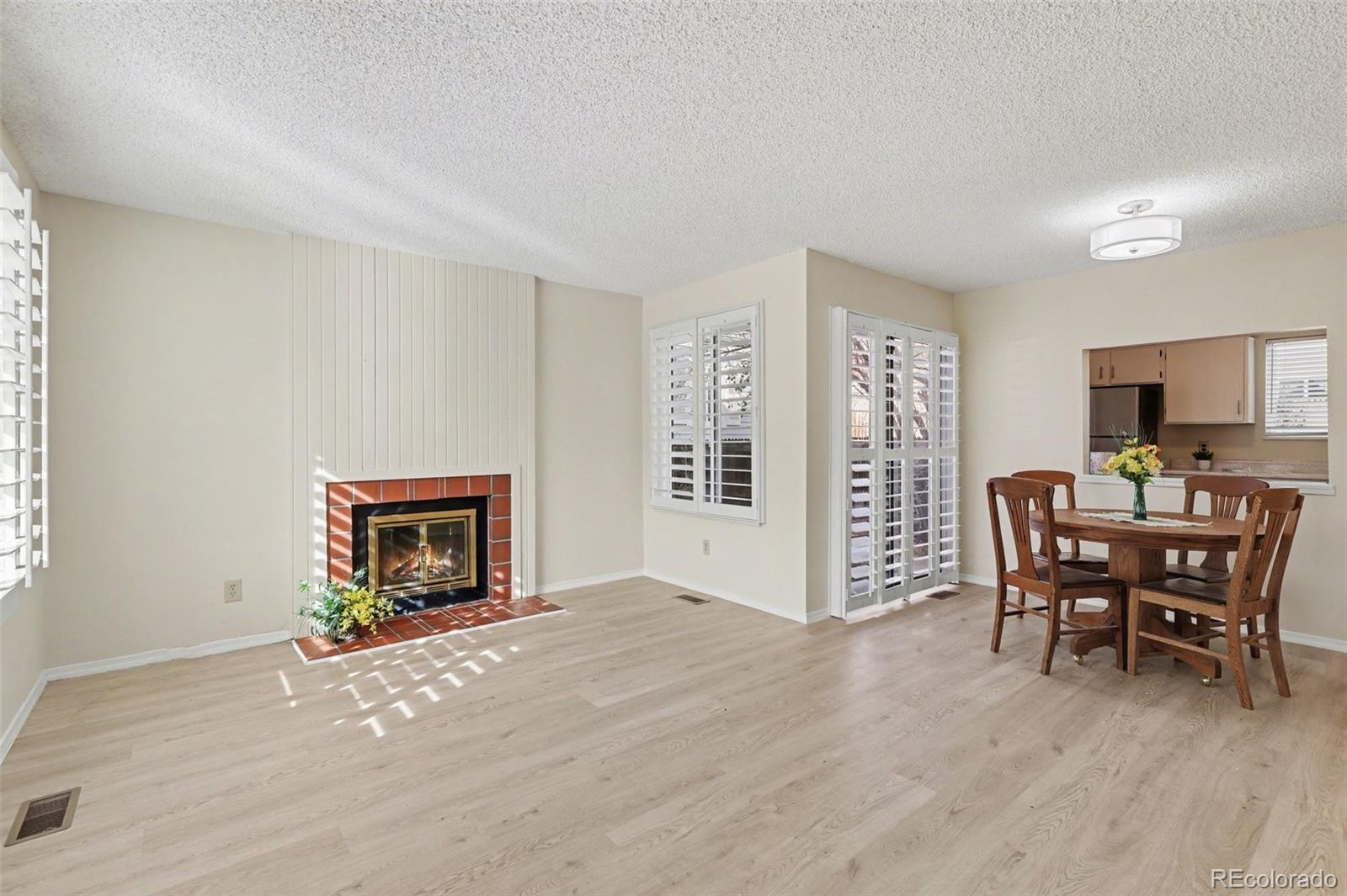 15922 East Rice Place, Unit B Aurora, CO 80015 - Photo 5 of 30 a view of livingroom with furniture and a fireplace